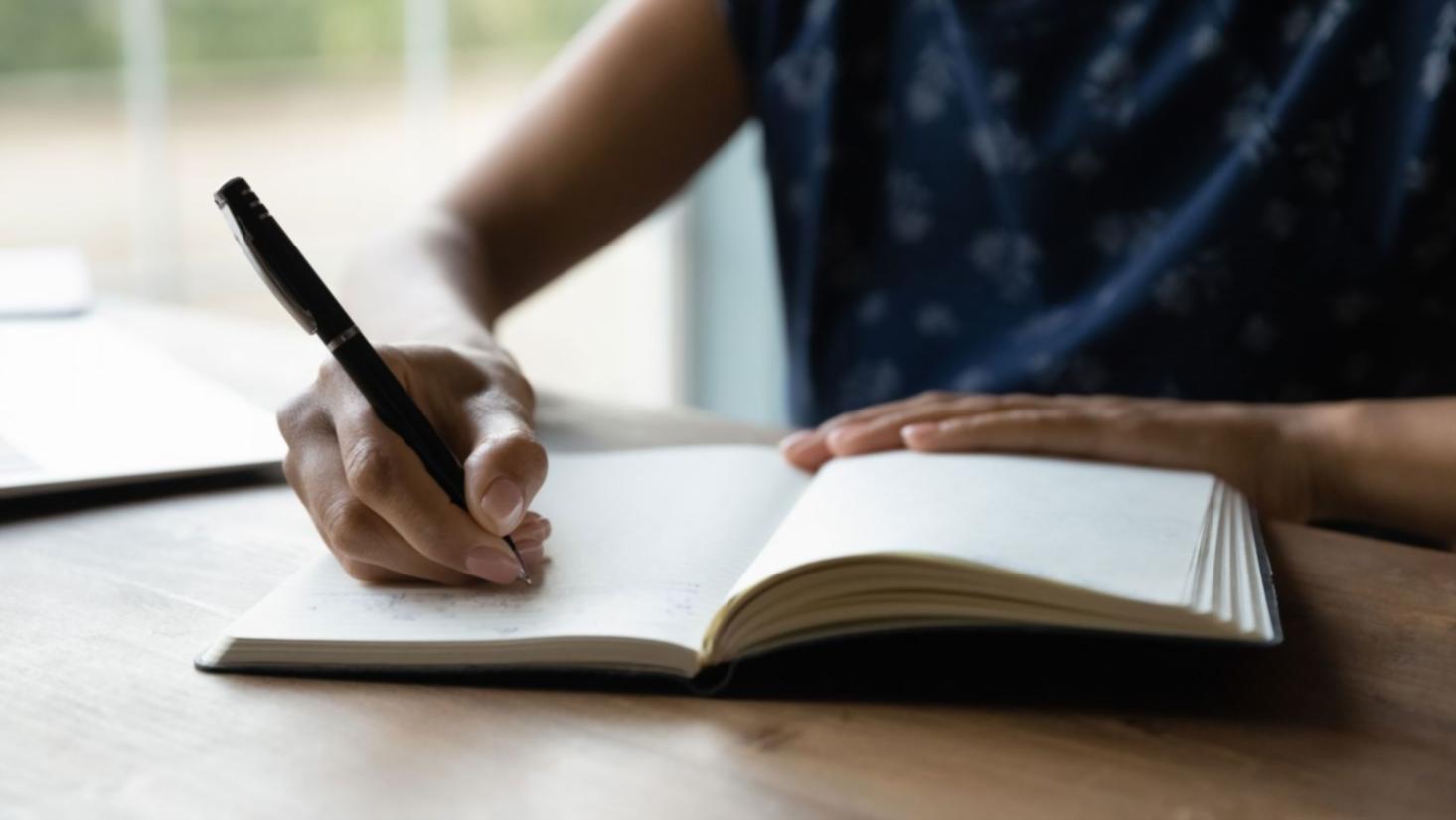 Close-up of a blogger writing and editing on screen